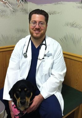 Picture of Dr. Costuma and his dog, a Rottweiler mix, named Shiloh